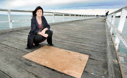 Cr Debbie Hawes with the section of Urangan Pier that has been burnt – about 20 metres from the end of the pier. Cr Debbie Hawes with the section of Urangan Pier that has been burnt – about 20 metres from the end of the pier.